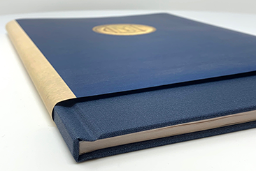 Hardcover book with cloth book cover and printed dust jacket